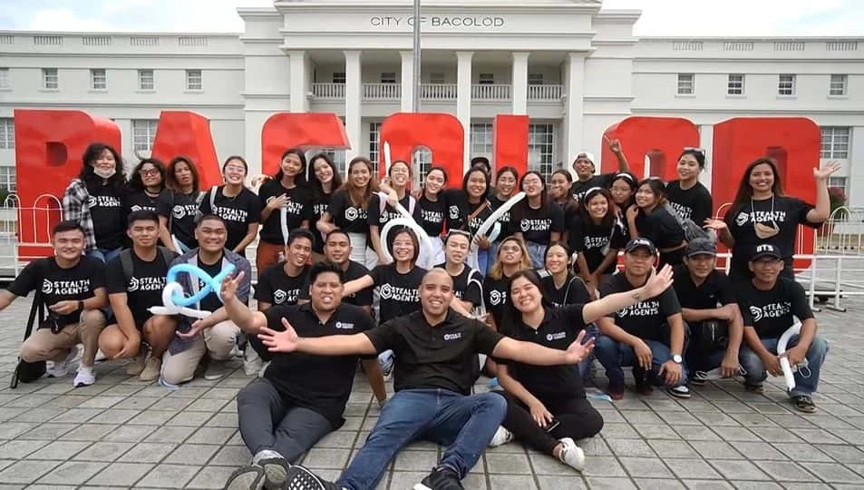 The official StealthAgents team gathered outside the City of Bacolod building